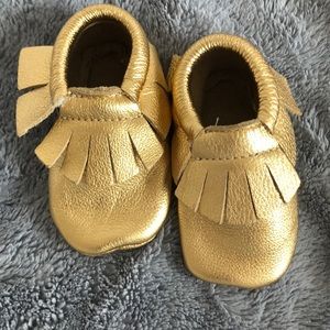 Gold baby moccasins